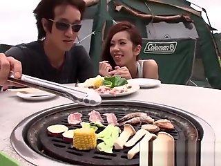 Japanese girlfriend blows her guy outdoors